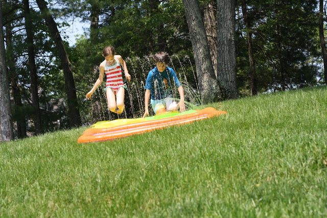 the current goings-on at the hunt house: slip-and-slide!